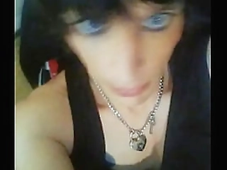 brunette ladyboy in black stockings plays with her monster cock in bed