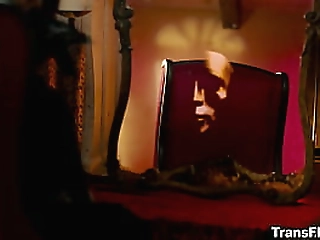 sexy fishnet tranny in gloves riding cock on the couch