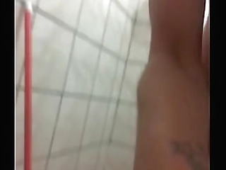 brunette ladyboy in white stockings strokes her small cock in bed