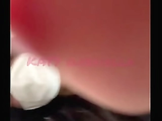 horny asian shemale in colourful party dress tugs on her small dick